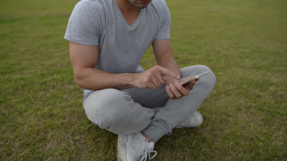 Using Smartphone, Sitting on Grass