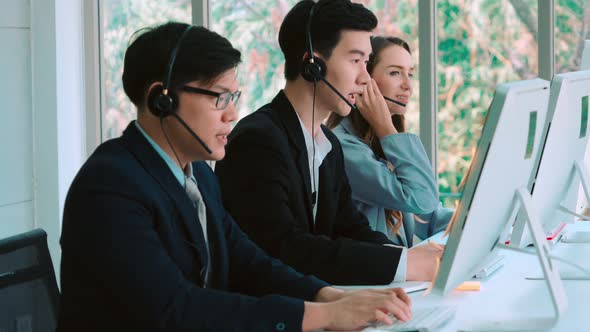 Business People Wearing Headset Working in Office