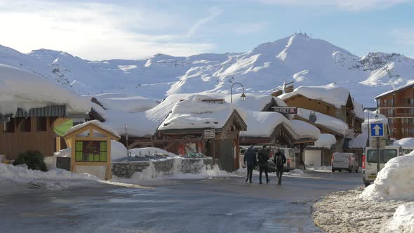 Three men walking on the street in Val Thorens, France