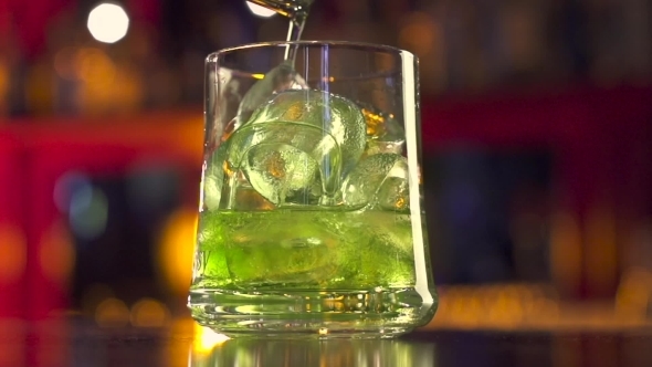 Barman Pouring Coctail On Black Table With