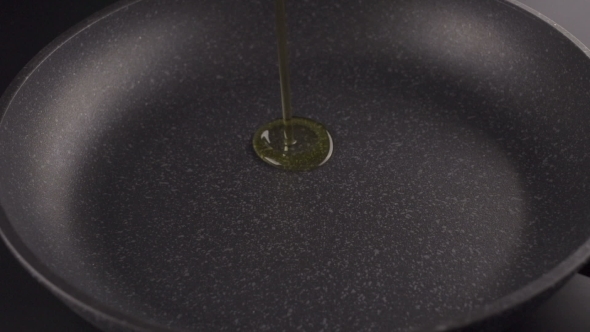 Pouring Oil Into Frying Pan