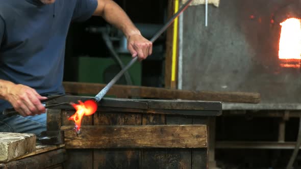 murano glass blower creates horse in venice