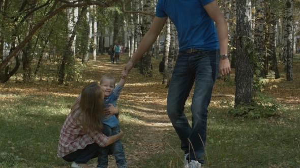 Small Boy Running Towards He's Beautiful Mother