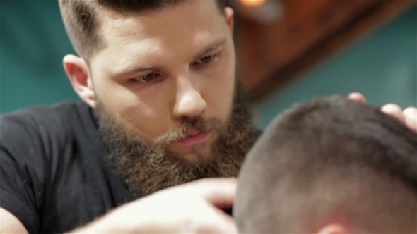 Bearded Brutal Man In a Barber Shop
