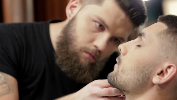 Barber Shave And Modeling Beard At The Hair Salon