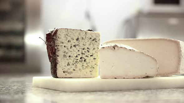 Various Cheeses at Modern Kitchen Counter