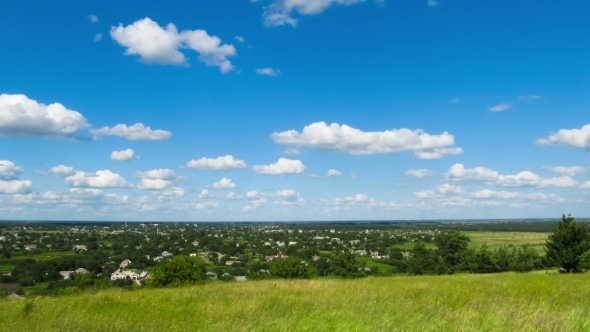 Landscape, Clouds Moving Over a Field With Trees.