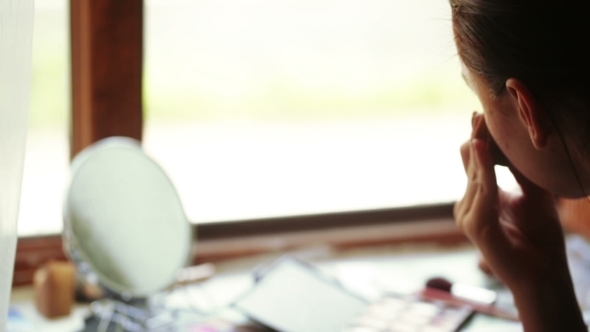 Girl At Window Does Makeup