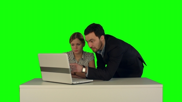 Couple Discussing New Project On The Laptop