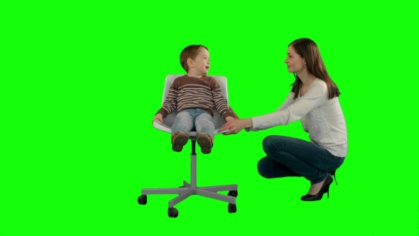 Mother And Boy Play Game On a Green Screen