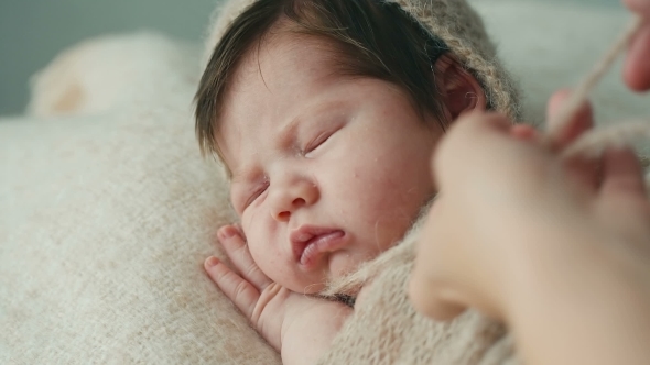 Cute Newborn Baby Sleeping On a Blanket