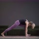 Lonely Woman in Sportswear Doing Side Plank in a Spacious Yoga Studio - VideoHive Item for Sale