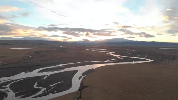 Wide Panning Shot of Sunrise Over Icelandic River.