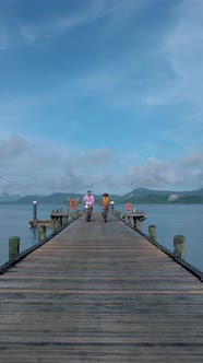 Couple Men and Woman on a Bike at a Tropical Island in Thailand Near Phuket Couple Man and Woman