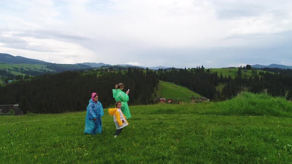 Family Wearing Raincoats