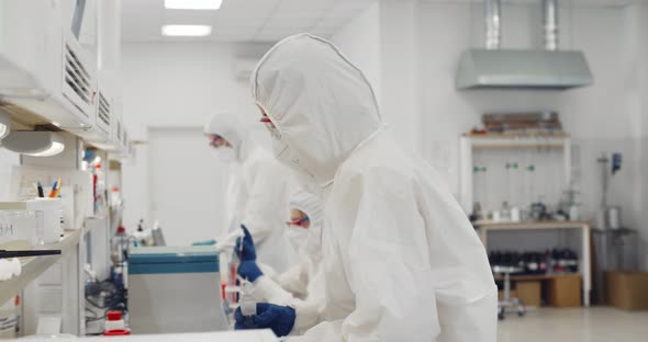 Biotechnology Scientist Wearing Ppe Suit Researching in Equipped Laboratory