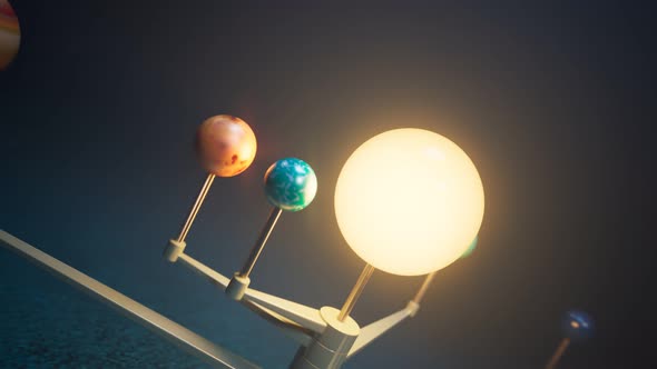 Toy Solar system animation Planets on the spinning arms rotating around the Sun