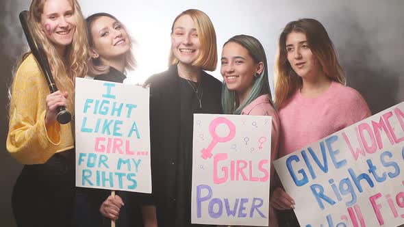 Smiling Happy Feminists Women Together in Smoky Space