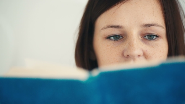 Beautiful Young Woman Reading Book 