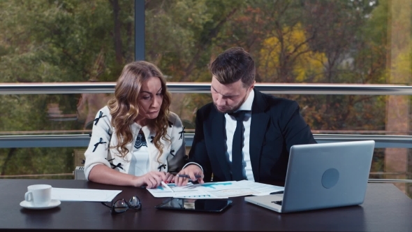 Man And Woman In Business Suits Are Upset