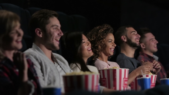 A Group Of People Watching a Movie Showing Emotion
