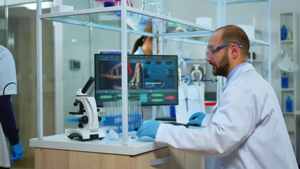 Biologist Doctor Checking DNA Samples alt