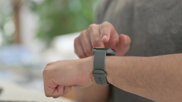 Hands of Young Man Using Smartwatch Close Up