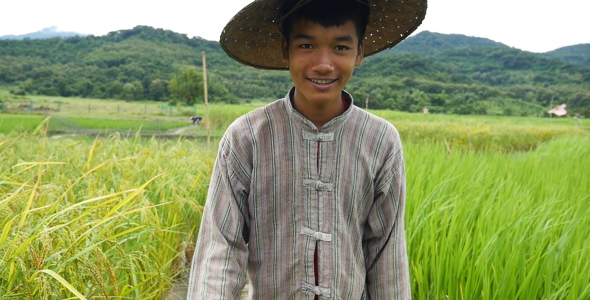 Asian Farmer Walking And Smile