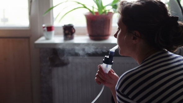 Woman Wears a Mask For Inhalation, And Conducts