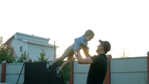 Father Spinning Son In The Air