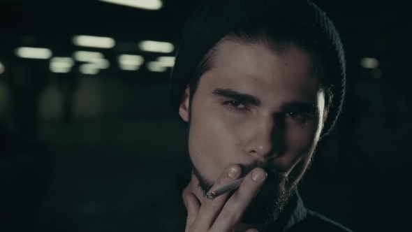 Young Handsome Bearded Man Smoking Cigarette 