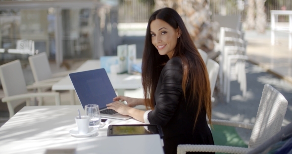Elegant Businesswoman Working On a Laptop
