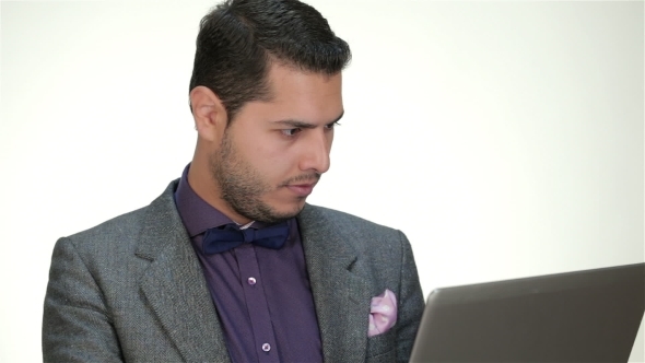 Clothed Formally Male Working On a Laptop