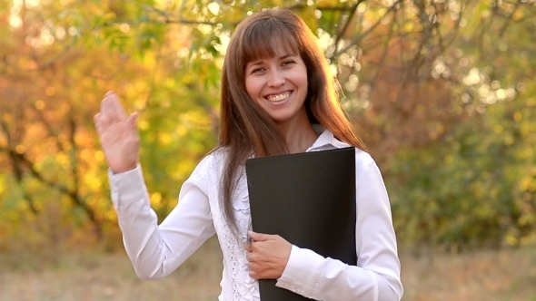 The Schoolgirl Waves a Hand