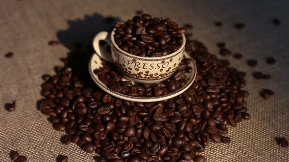 A Cup With Coffee Bean As Background