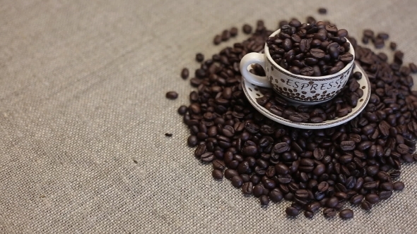 A Cup With Coffee Bean As Background