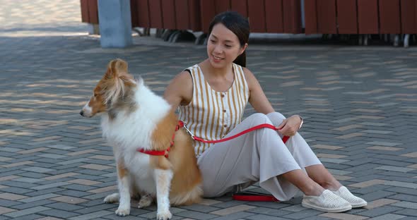 Woman pet owner with her herding dog at outdoor