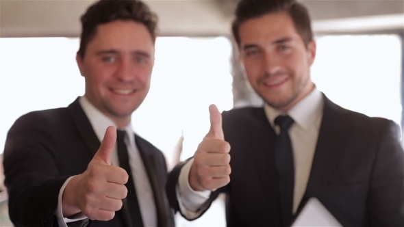 Formally Dressed Businessman Thumbs Up