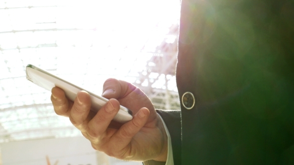 Businessman Chatting On Smartphone