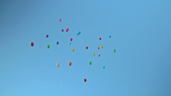 Balloons Flying In The Blue Sky