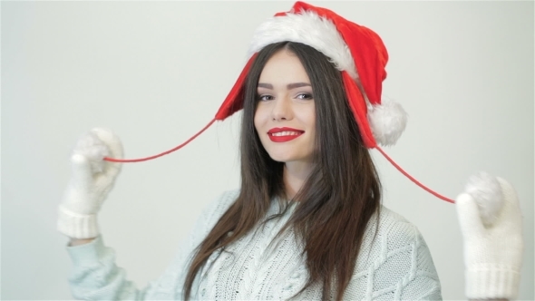 Beautiful Woman With Christmas Hat Is Posing