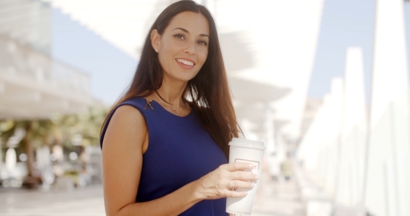 Attractive Woman Holding a Large Cup Of Coffee