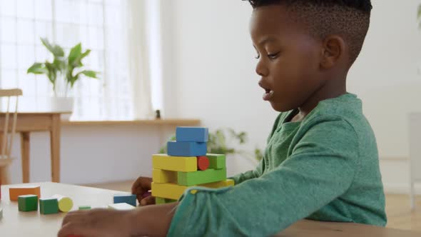 Young boy playing at home