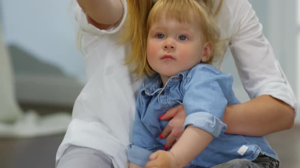 Mother and Happy Baby Taking Selfies