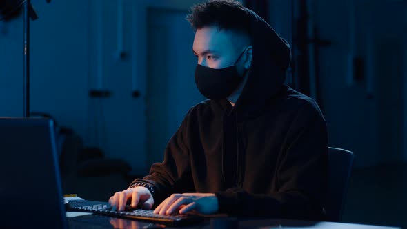 Hacker Using Computer for Cyber Attack at Night 15