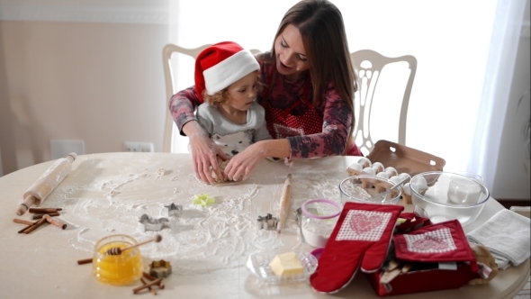 Mother Helping Daughter To Knead The Dough alt
