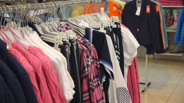 Panorama View Of Multicoloured Clothes On Hangers 