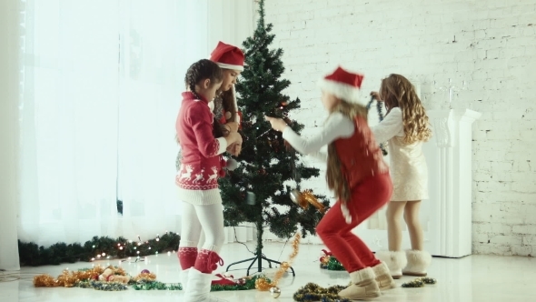 Children Decorate The Christmas Tree