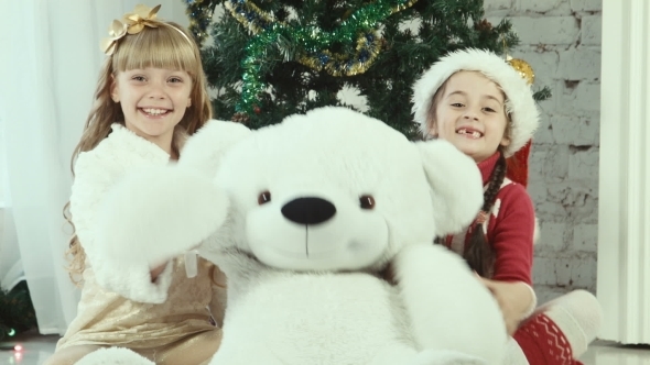 Two Girl Hiding Behind The Bear And Smiling 