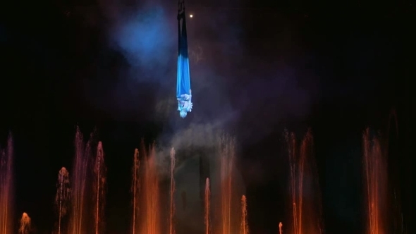 Aerial Performance On The Stage With Fountains